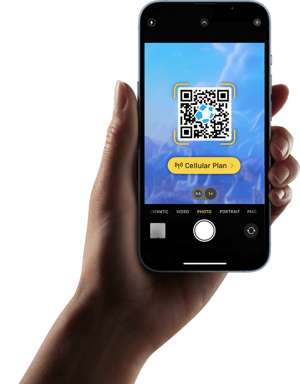 Hand holding a smartphone with QR code