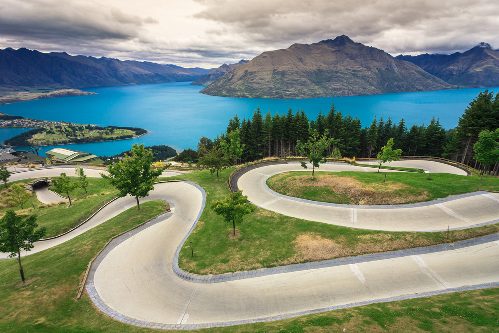 Luge-track-with-beautiful-lake-and-mountain-at-Skyline-Queenstown-New-Zealand